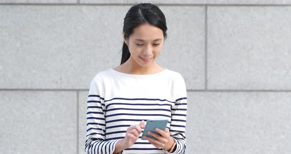 Woman use of mobile phone at outdoor