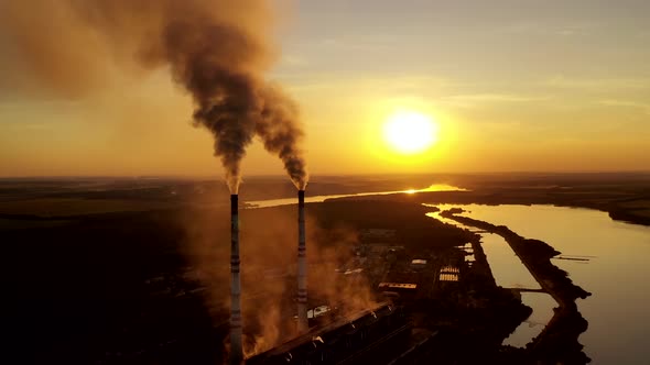 Metallurgy Plant in Nature at Orange Sunset