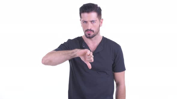 Angry Young Bearded Man Giving Thumbs Down