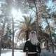 Walking Girl Between Palms - VideoHive Item for Sale