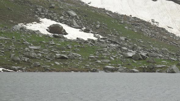 Hail on the Mountain Lake in High Altitude Meadow