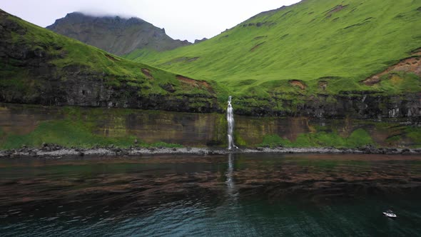 Aerial view of a waterfall at Driftwood Bay, Unalaska, Alaska, United States.