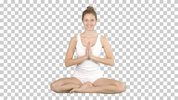 Beautiful Young Woman Yogi Rising Her Eyes to Camera and Smiles