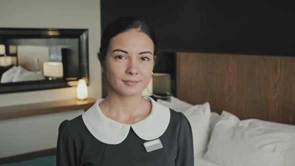 Female Housekeeper at Work in Hotel