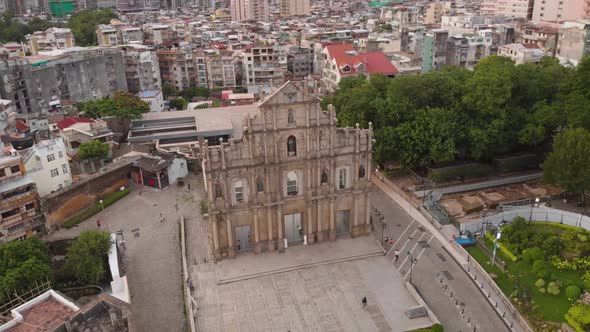 Rotating tilting aerial of Ruins of Saint Paul's revealing Monte do Forte