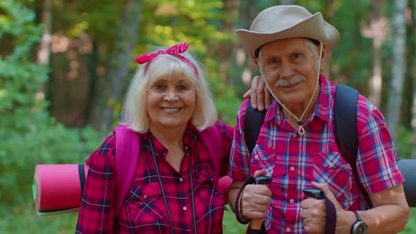 Senior Old Elderly Grandmother Grandfather Training Nordic Walking with Ski Trekking Poles in Wood