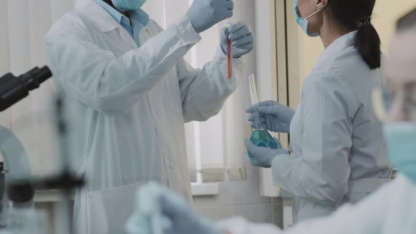 Chemists Discussing Research in Lab alt