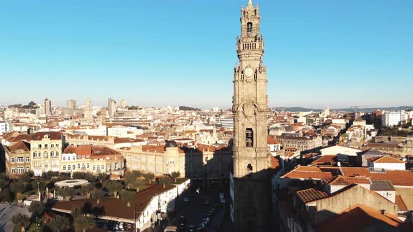 4k aerial drone footage of the iconic Clérigos Tower of coastal city of Porto in northwest Portugal.
