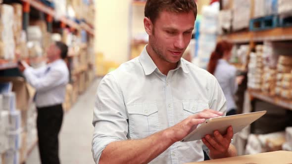 Warehouse Manager Using his Tablet PC