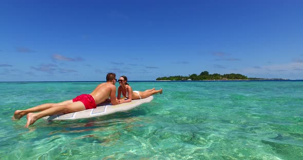 Fun lady and man married on vacation spend quality time on beach on white sand background