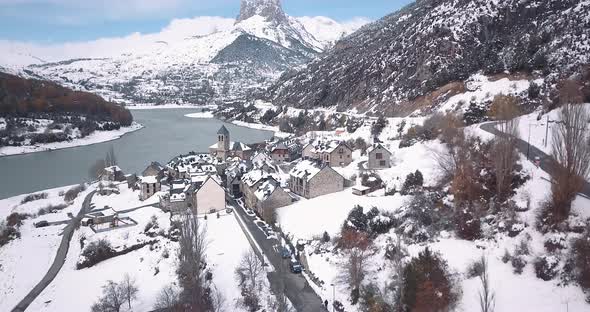 Drone crane shot over the village of Lanuza in the Spanish Pyrinees after the first snowfall of the