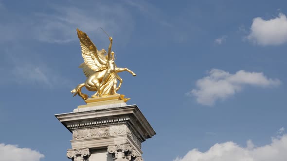 Famous Pont Alexandre III columns with golden statues slow  pan 4K 2160p 30fps UltraHD footage - Par