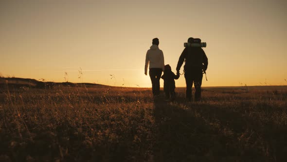 Silhouettes of Father Mother and Little Son