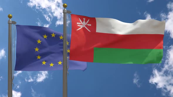 European Union Flag Vs Oman Flag On Flagpole