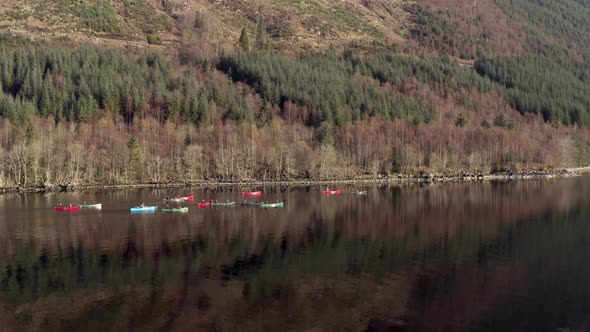 A Team of Canoeists Crossing a Lake in the Early Morning