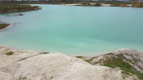 Aerial Drone View Amazing Industrial Landscape on Emerald Lake in a Flooded Quarry