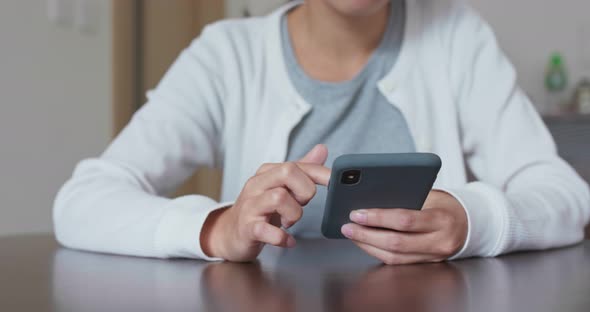 Woman use of smart phone at home