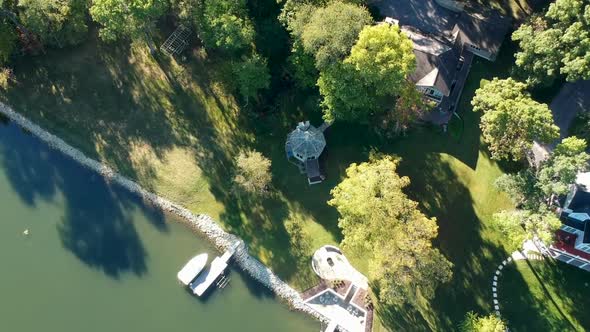 Lake Shore Drone Shot with Green Water and Boats