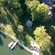 Lake Shore Drone Shot with Green Water and Boats - VideoHive Item for Sale