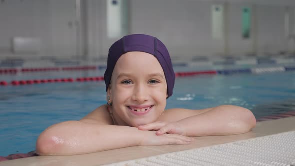 Girl Child in Swimming Pool. Smiling Child Leads a Healthy Lifestyle and Keen on Sports.