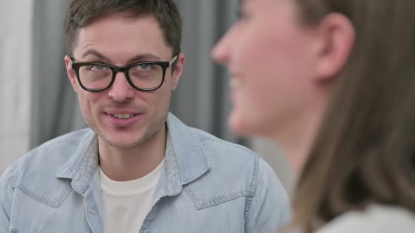 Close Up of Cheerful Young Couple Having Conversation