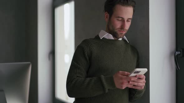 Meditative man texting by phone