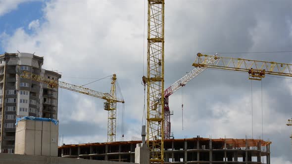 The Construction Crane Turns, Loads The Concrete Column Onto The Platform
