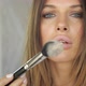 Beautiful Girl Blows Powder From the Brush Directly Into the Camera - VideoHive Item for Sale