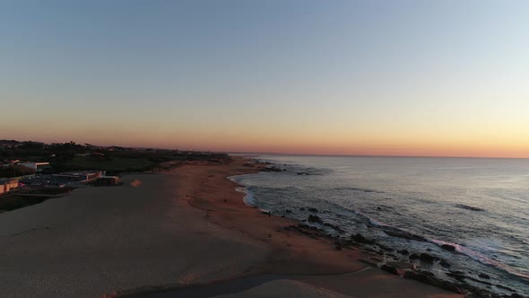 Flying Over Sandy Beach at Summer Sunset