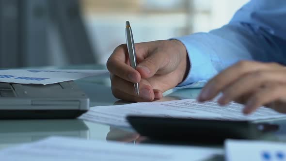 Businessman Calculating Companys Taxes, Filling Out Annual Statement, Finances