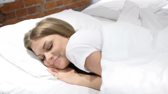 Young Woman Trying to Sleep in Bed at Night