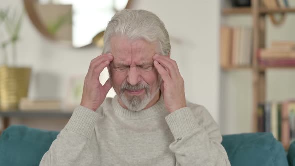 Old Man Having Headache at Home