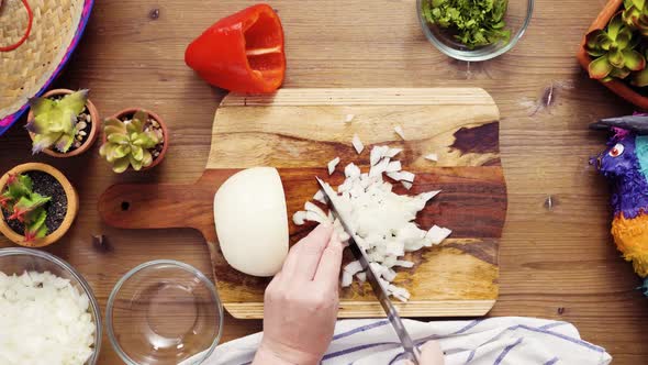 Flat lay. Step by step. Slicing vegetables for filling to make empanadas.