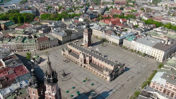 Flying over Main Square, Rynek Glowny in Krakow, Cracow city in Poland, Polska