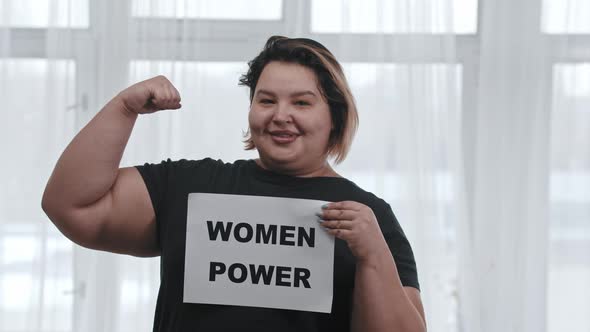 Concept Body Positivity a Fat Smiling Woman Holds a Sign with the Inscription WOMEN POWER and