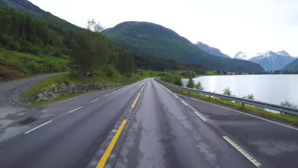 Driving a Car on a Road in Norway