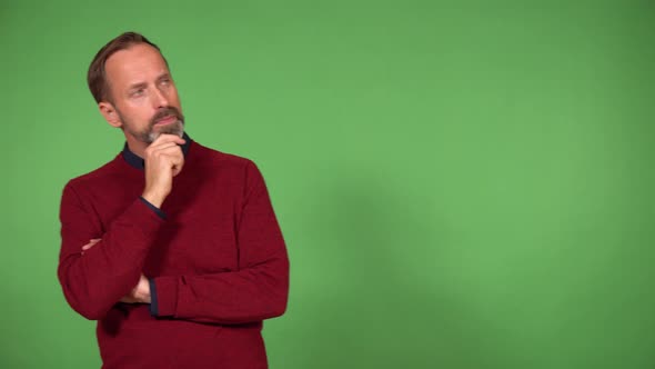 A Middleaged Caucasian Man Thinks About Something and Walks Back and Forth  Green Screen