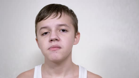 Smiling Boy Chewing Gum Looking at the Camera