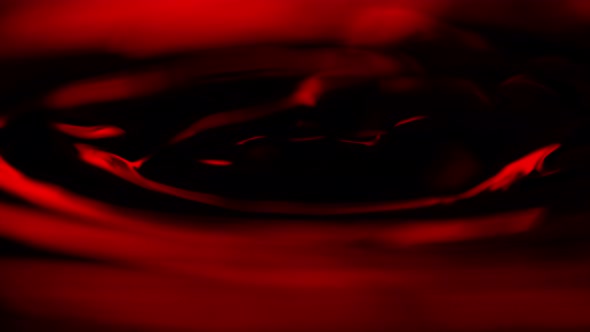 Super Slow Motion Macro Shot of Swirling Red Wine in Glass at 1000Fps.