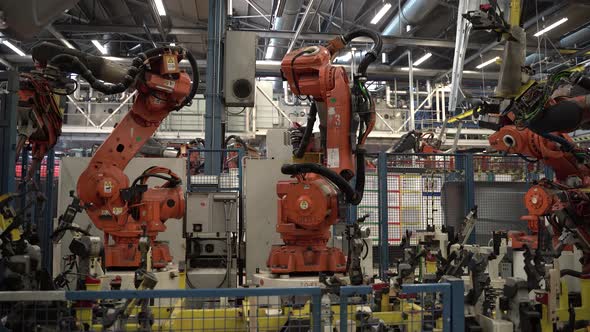 Robotic Arm Assembling Car Frame in Modern Factory 4K