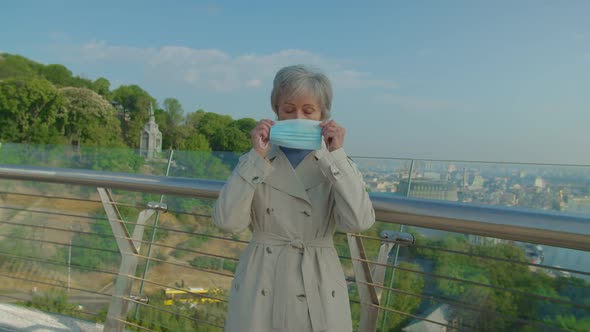 Portrait of Senior Woman Wearing Medical Mask in Quarantine Mode