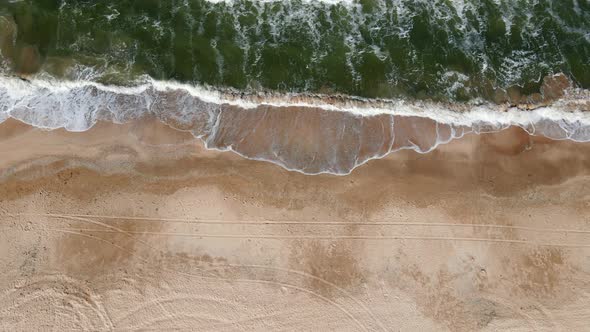 Drone Flight Over the Azure Sea with Waves and Sandy Coast