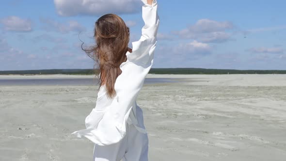 Beautiful Woman Walking on Shore