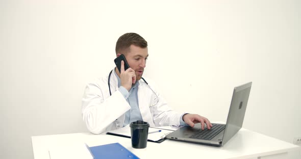 Male Doctor Work with Laptop at Office