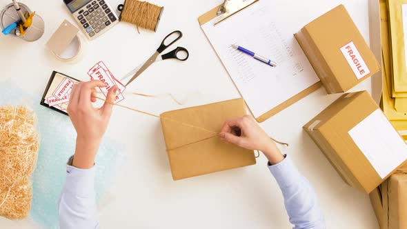 Woman Packing Parcel Box at Post Office 5