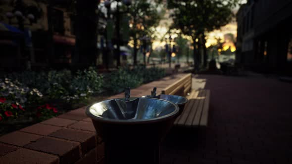 Closeup of a Drinking Water Fountain in a Park on Sunset
