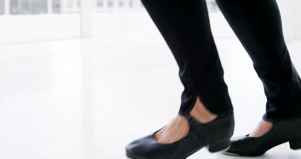 Dancer practicing contemporary dance with bowler hat