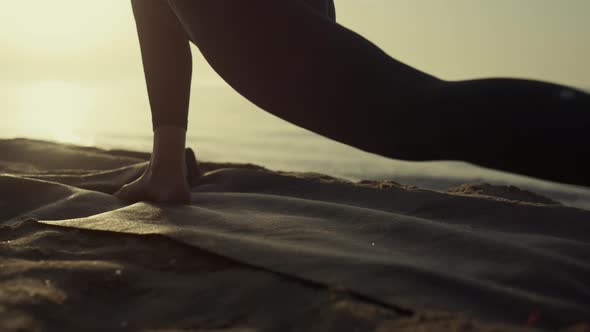 Unknown Bare Woman Legs Stretching on Beach Closeup