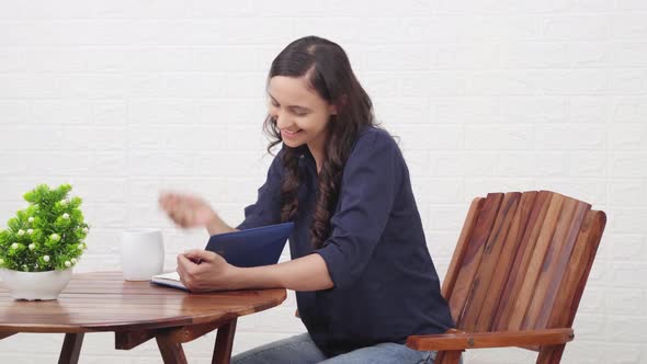 Attractive Indian girl writing something