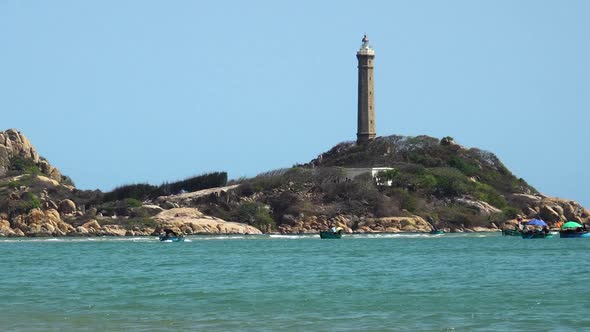 Gimbal zoom in shot of Ke ga lighthouse on sunny day, Vietnam